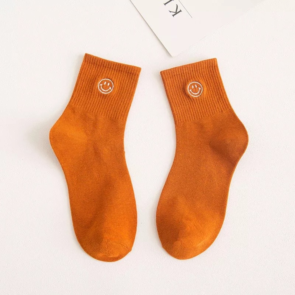 Orange smiley face socks